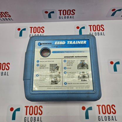 OCENCO M-20.2T EEBD TRAINER BREATHING DEVICE Blue EEBD trainer case with operating instructions against a branded background.