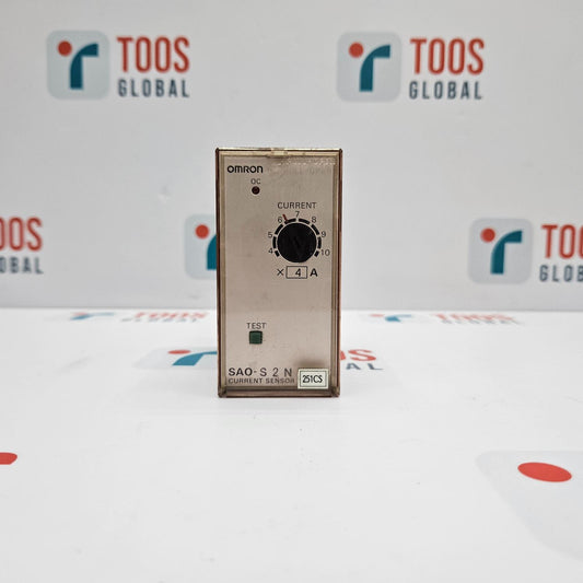 OMRON SAO-S2N CURRENT SENSOR placed on a table with a logo displayed in the background.
