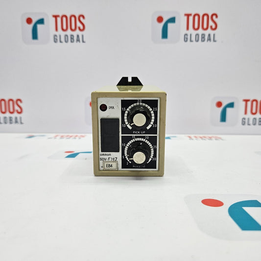 Small electronic device with dials on a white background with 'TOOS GLOBAL' branding.