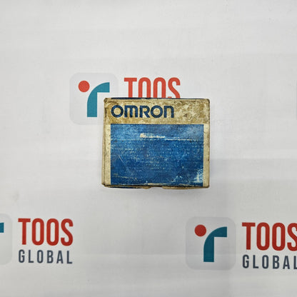 An OMRON limit switch with model number XE-Q21-2 and dimensions 25x6ra displayed on a surface with the brand logo visible in the background.