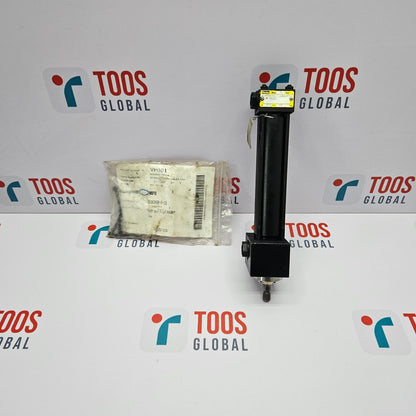 PARKER MC-M1100 PNEUMATIC CYLINDER packaged in a white plastic bag with a label, placed next to the cylinder which is black with a yellow label, on a background with the TOOS GLOBAL logo.