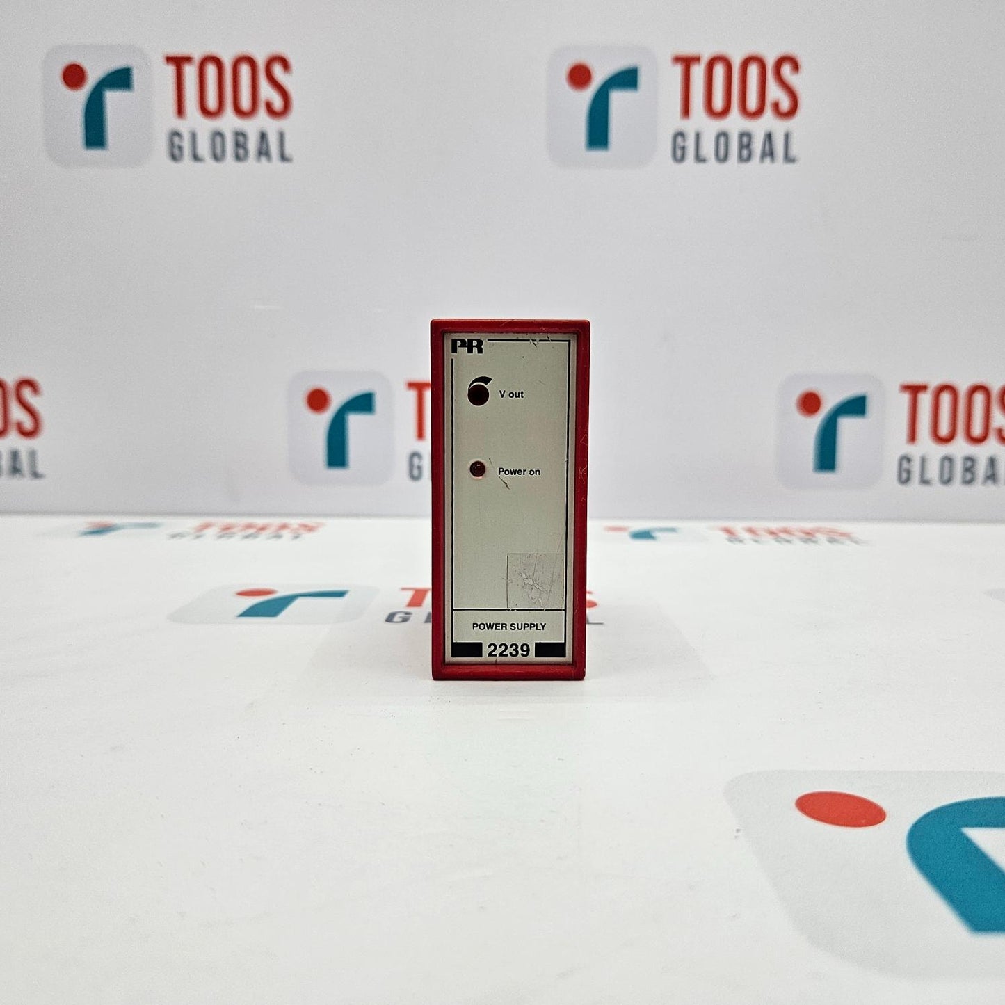 A PR Electronics 2239 power supply unit displayed against a backdrop with the TOOS Global logo.