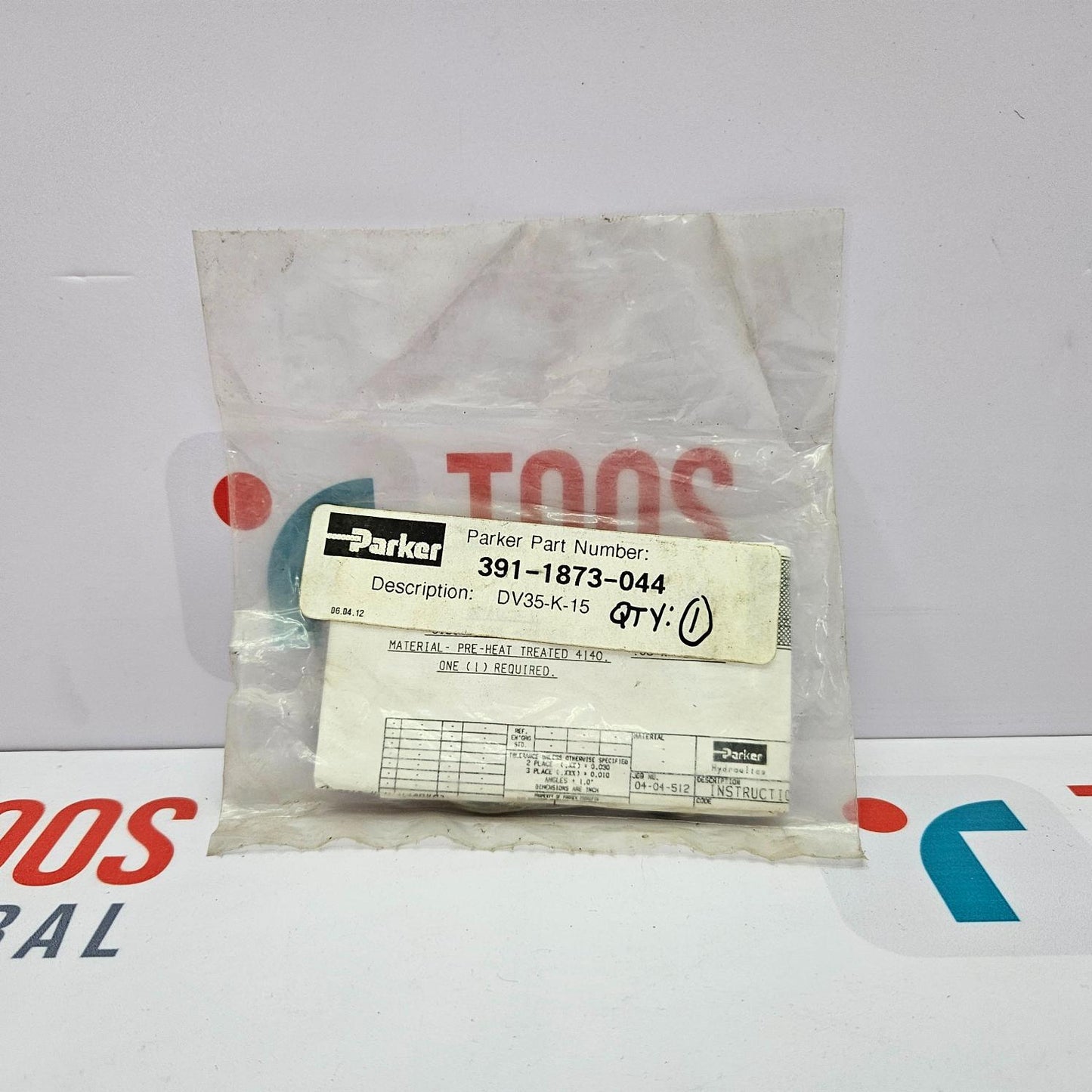 Parker part in a clear plastic bag with a label on a white background