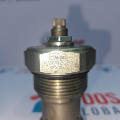 Metal valve or fitting with threading and a brand label on a blurred background