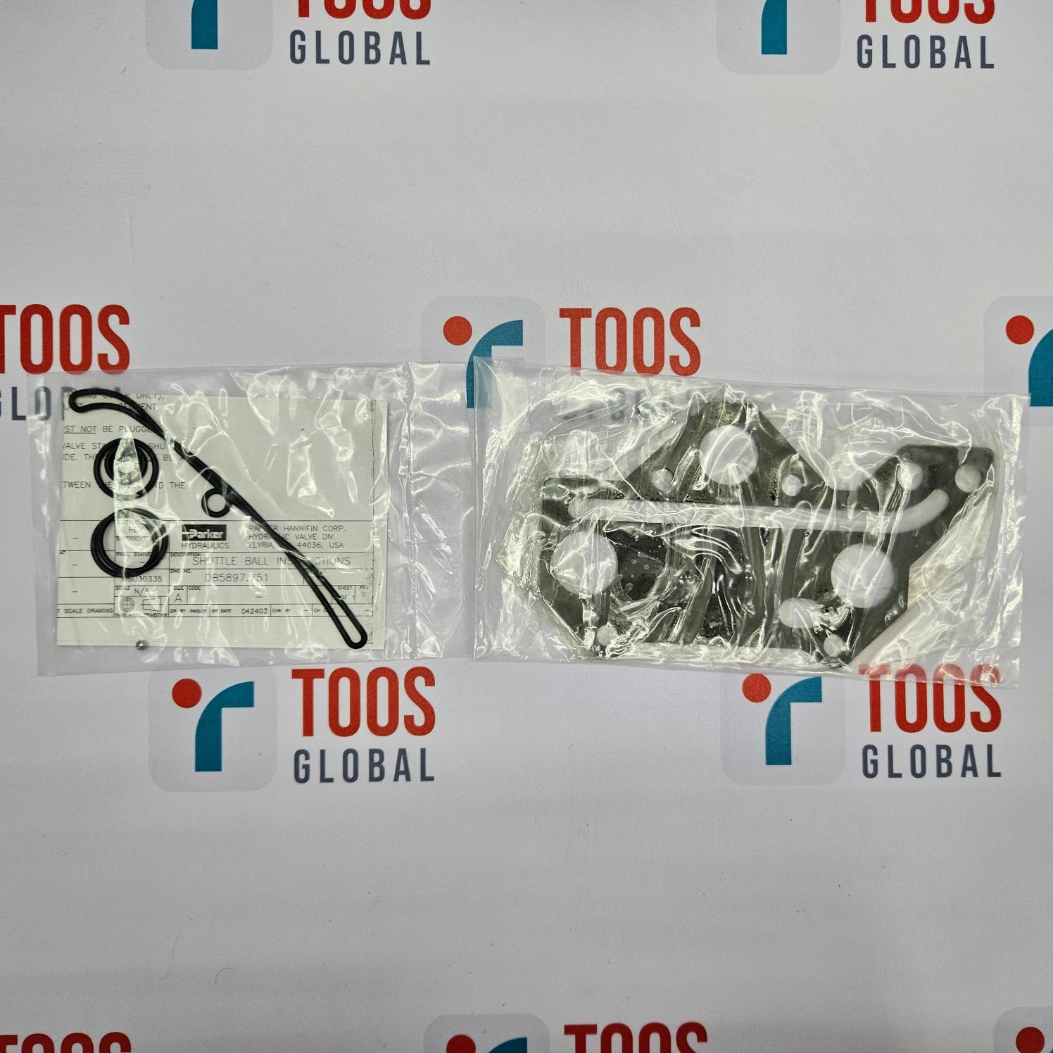 Two packages of medical supplies on a TOOS Global branded background