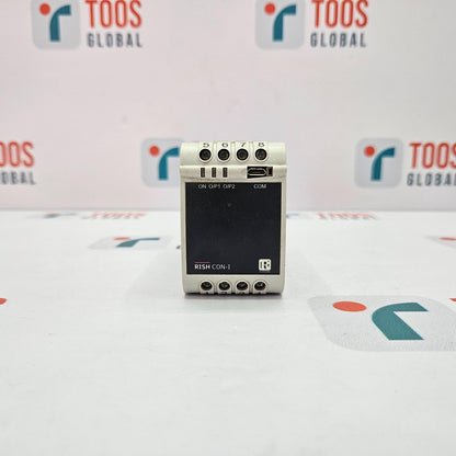 Small electronic device on a white surface with 'TOOS GLOBAL' branding in the background.