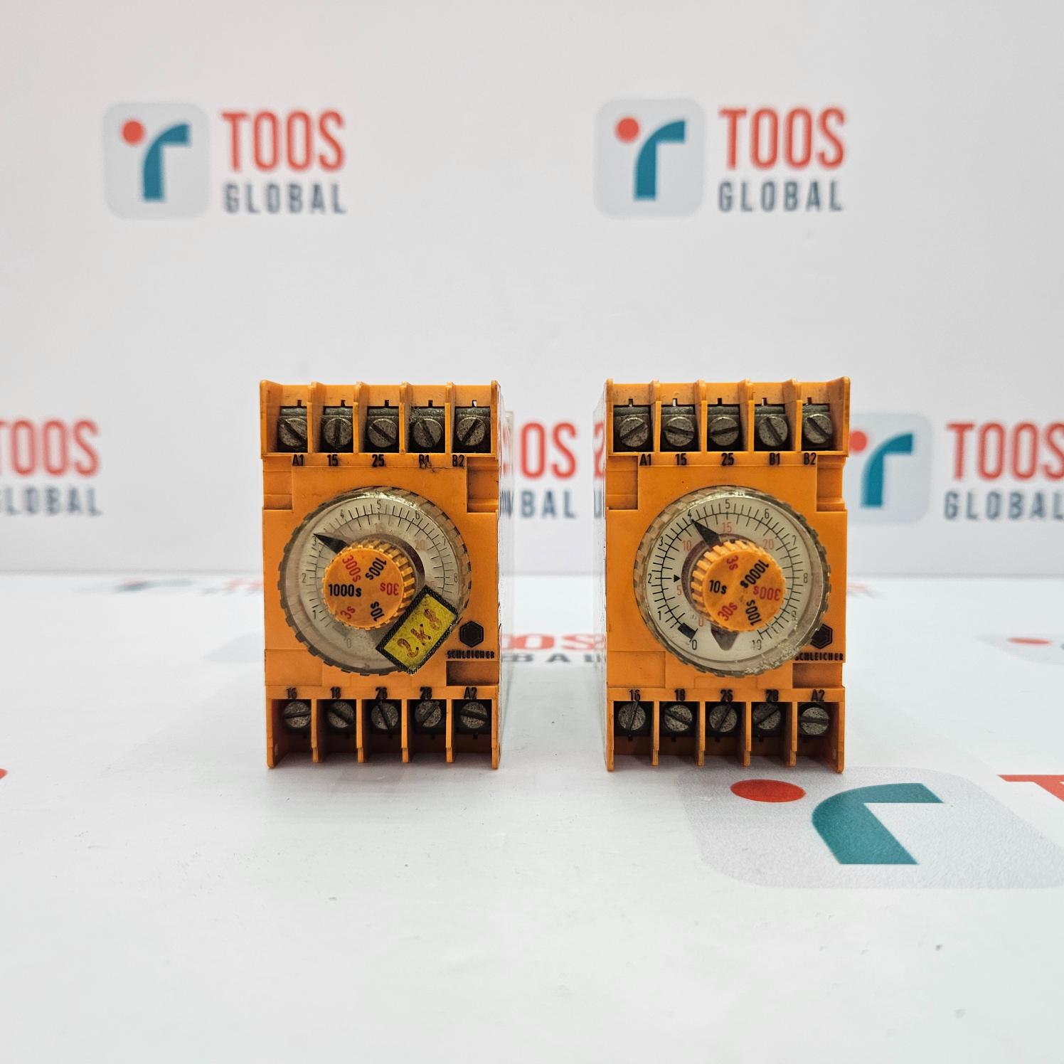 Two orange electronic devices with a clock face on a white background with 'TOOS GLOBAL' branding.