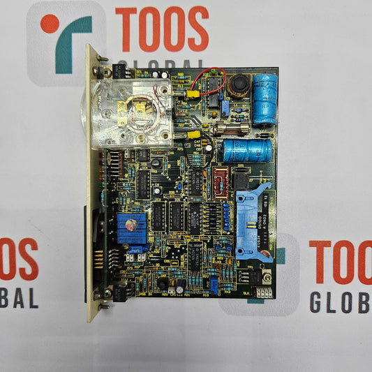 Electronic circuit board with various components on a TOOS GLOBAL branded background