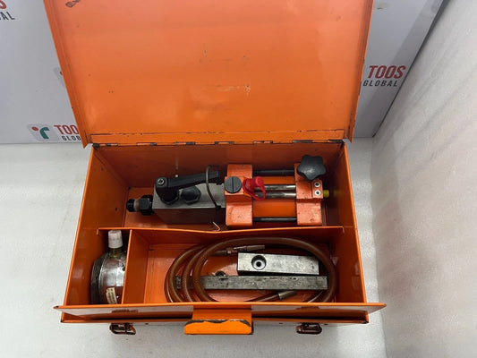 Orange tool box with tools inside on a white background