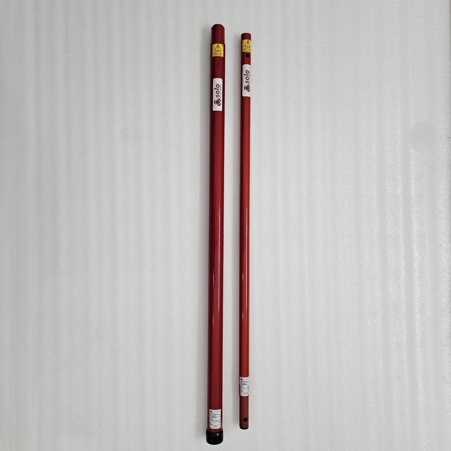 Two red poles with labels on a white background