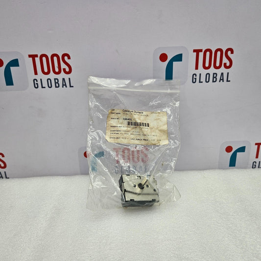 Small mechanical component in a clear plastic bag with 'TOOS GLOBAL' branding in the background.