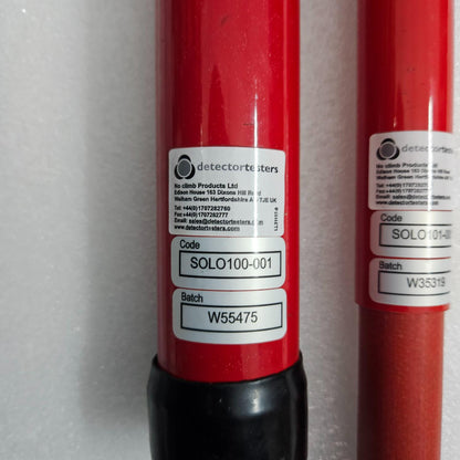 Two red cylindrical products with labels on a white background