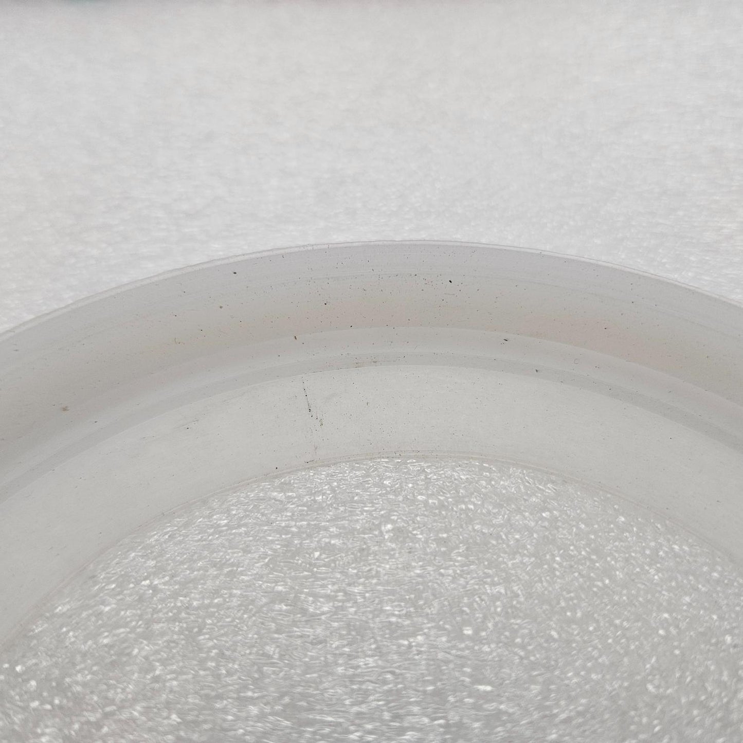 Solo 330 Replacement Silicon Membrane New on a white surface with a blurred background featuring a logo.