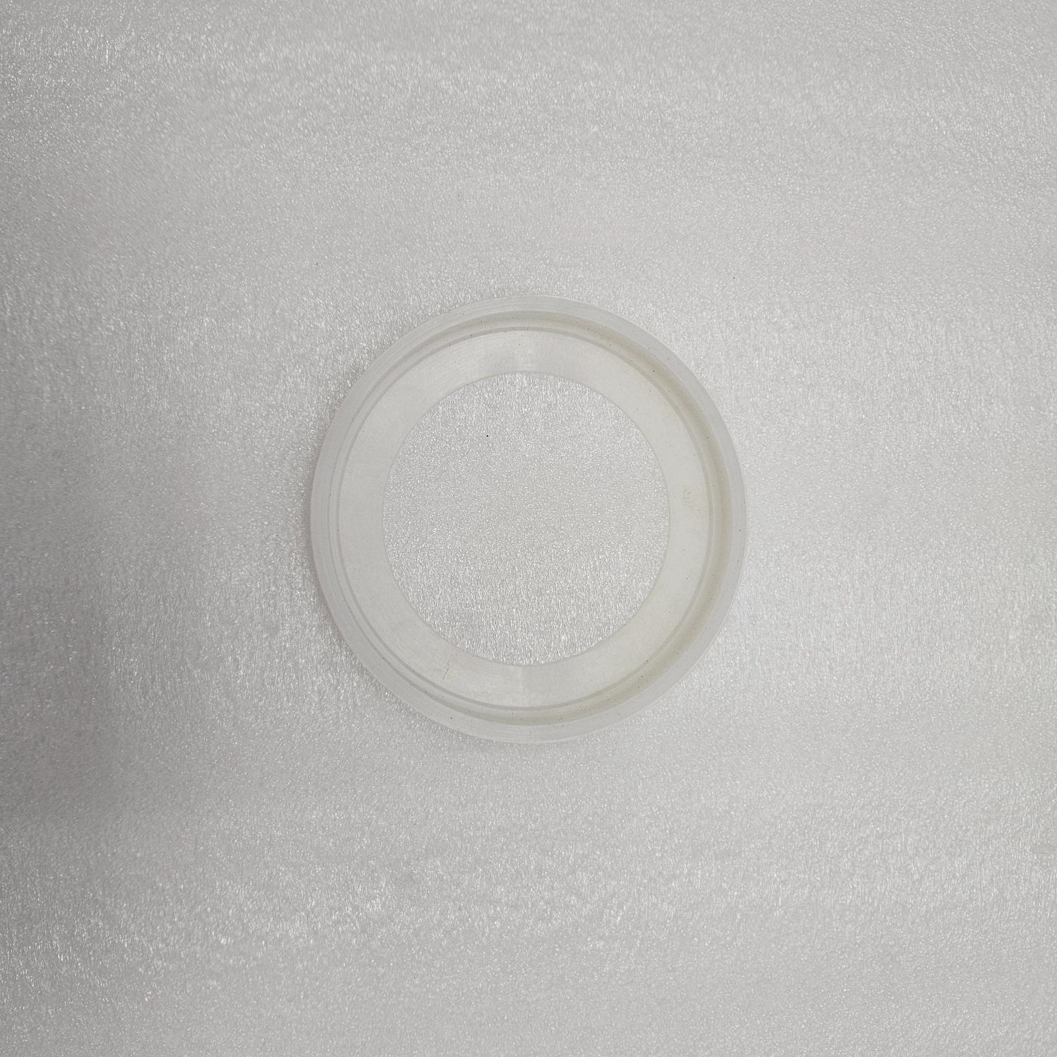 Clear plastic ring on a textured gray background