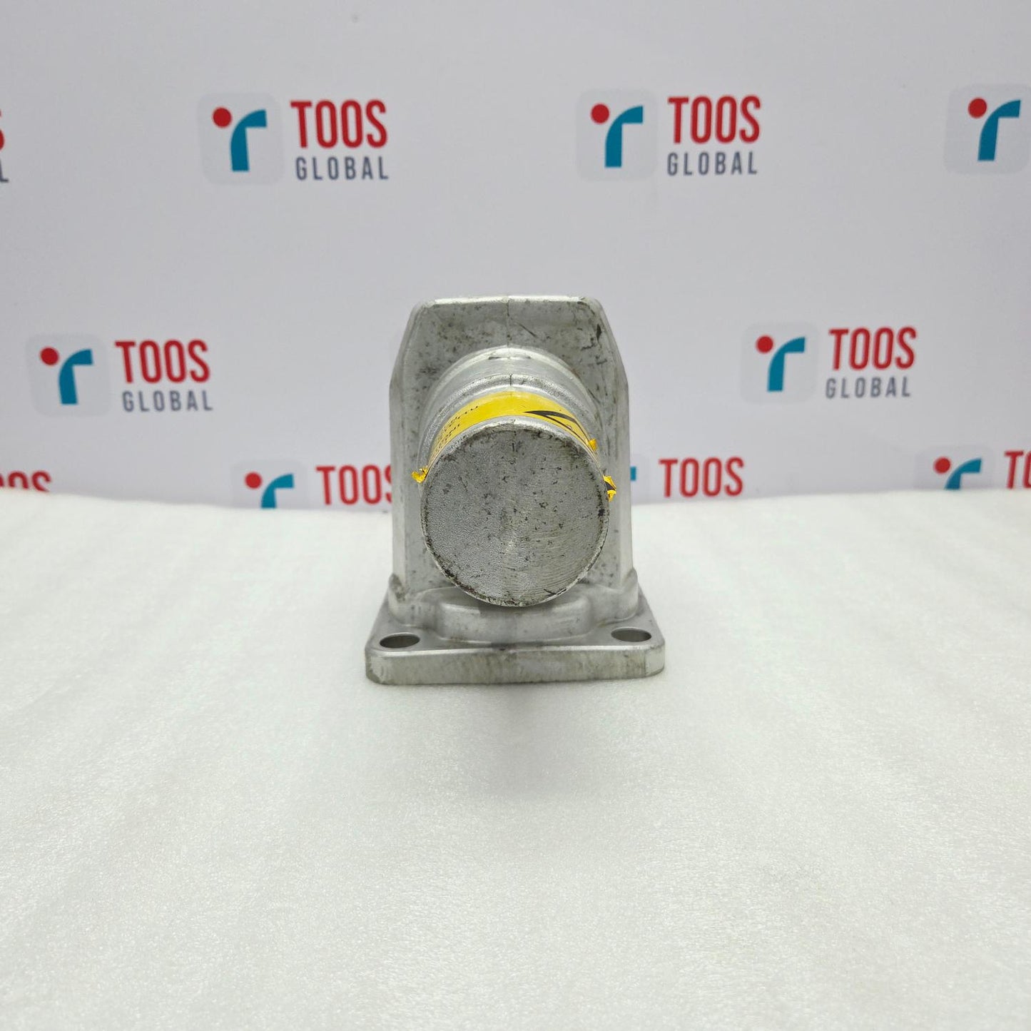 Metal component on a white background with 'TOOS GLOBAL' branding.