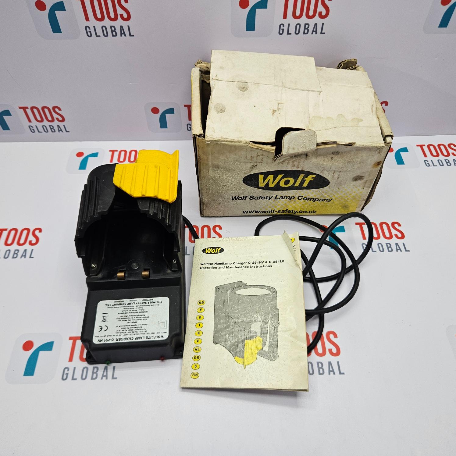 THE WOLF SAFETY LAMP COMPANY WOLFLITE LAMP CHARGER C-251HV Safety lamp with packaging and accessories on a branded background