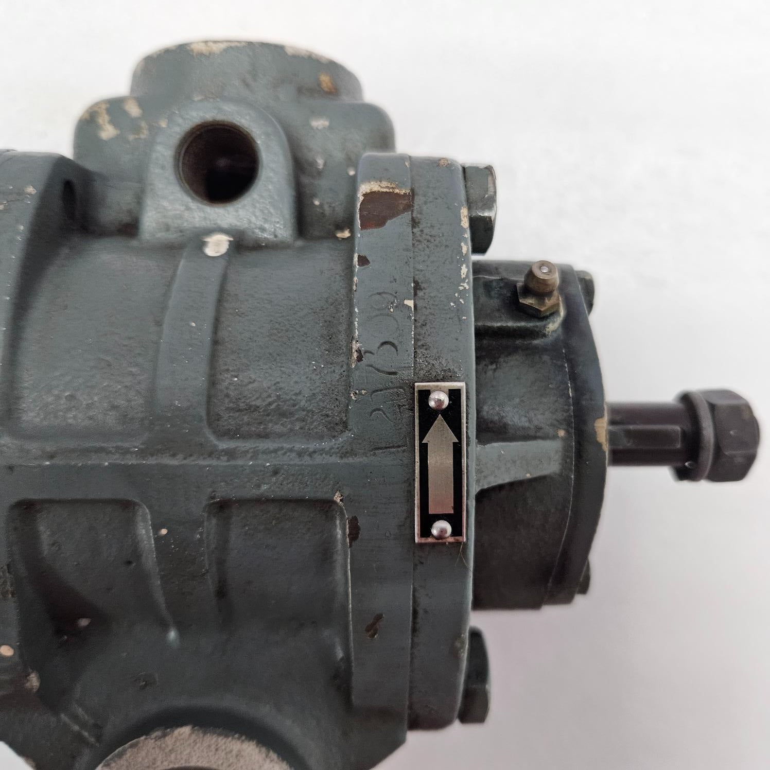 Close-up of a mechanical component with visible branding on a white background