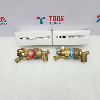 Two brass UNITOR flashback arrestors with their packaging on a white background featuring the 'TOOS GLOBAL' logo.