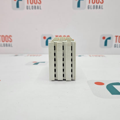 Small rectangular electronic component on a white background with 'TOOS GLOBAL' branding.