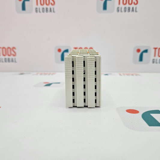 Small rectangular electronic component on a white background with 'TOOS GLOBAL' branding.