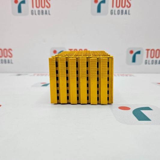 Stack of yellow plastic pallets with TOUS GLOBAL branding in the background