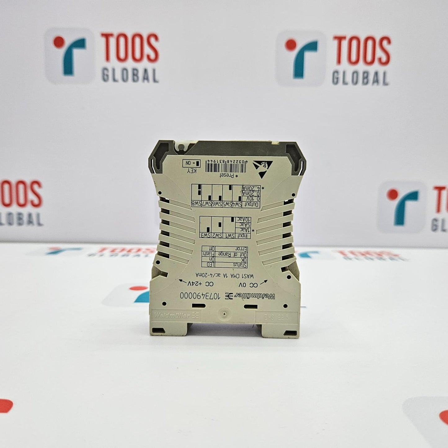 Electronic module with text on a white background featuring 'TOOS GLOBAL' logos.