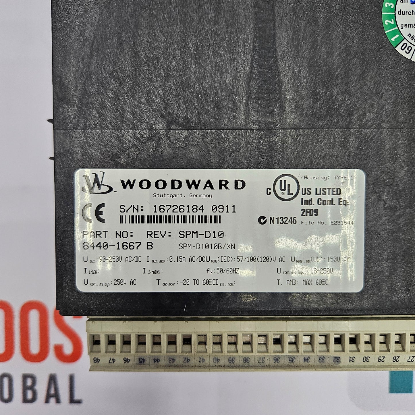 Woodward label on a mechanical component with visible text and symbols.