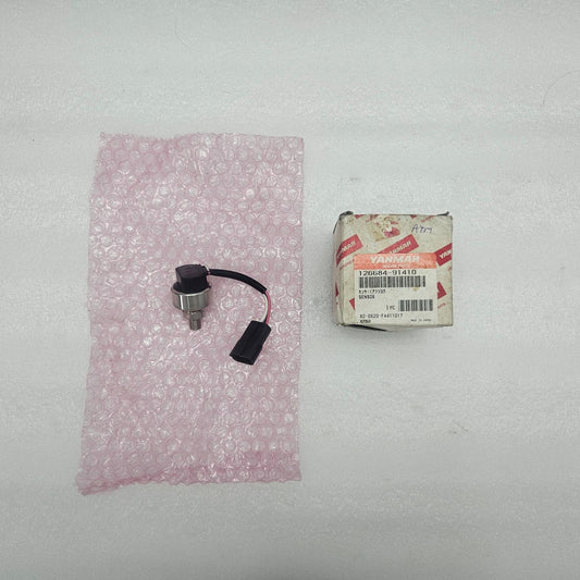 YANMAR GENUINE SPARES 126684-91410 PRESSURE SENSOR and packaging on a white background