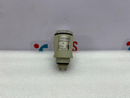 Mechanical component on a white background with a blurred logo in the background
