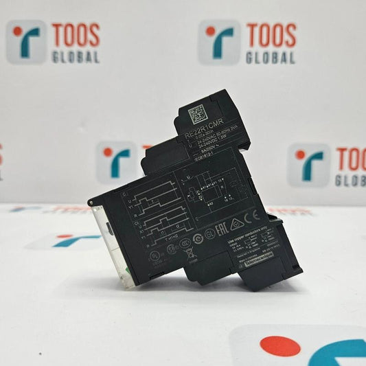 Electronic component on a white surface with 'TOOS GLOBAL' branding in the background.
